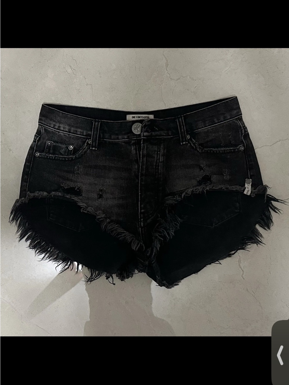 One Teaspoon black denim roller shorts with frayed hem and raw edges